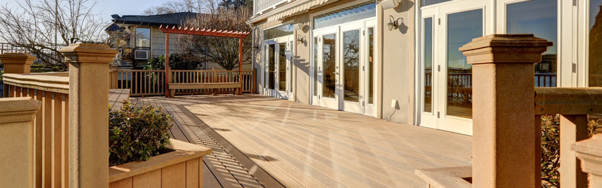A wide view of a home deck in the morning light